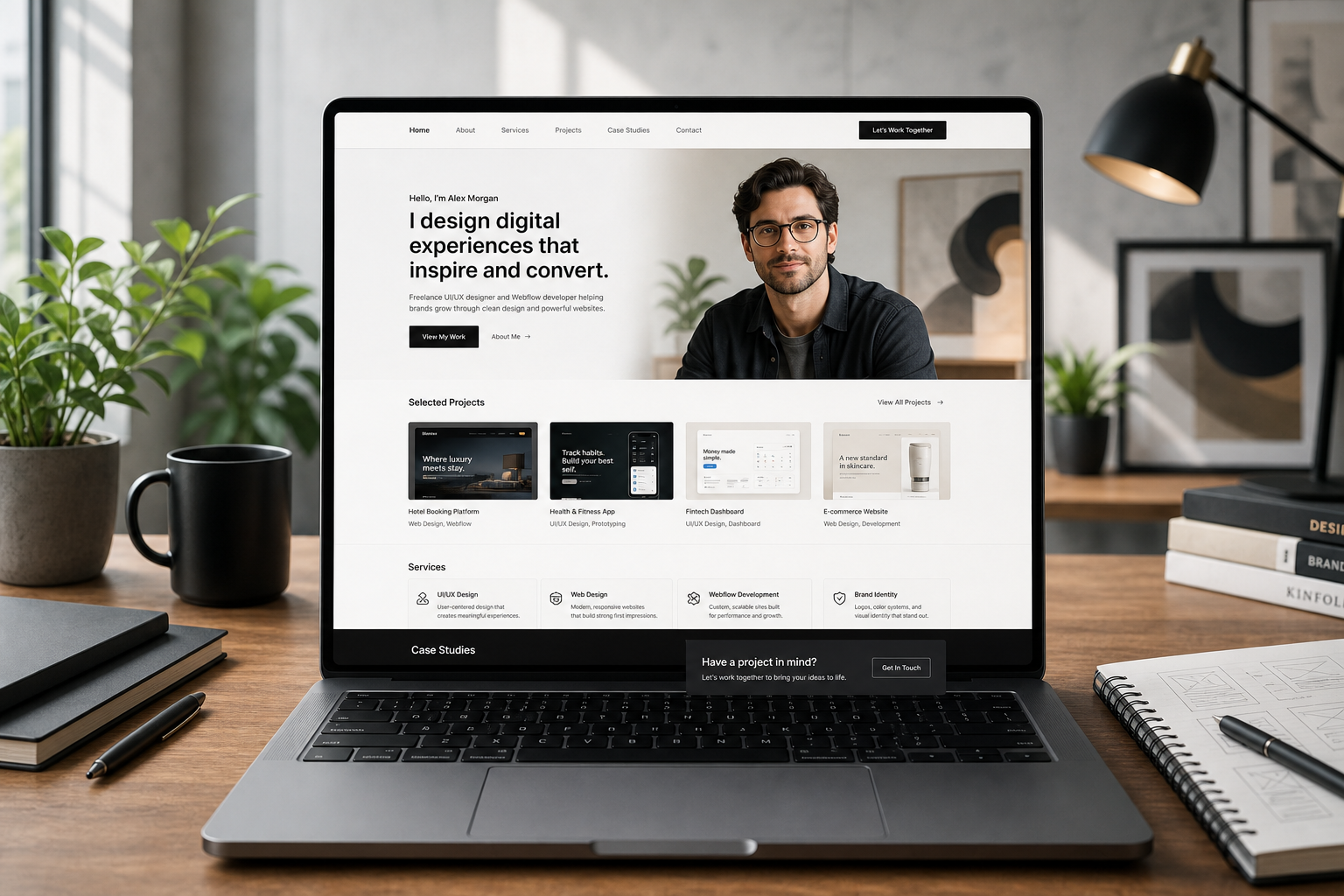 Premium personal portfolio website displayed in a creative workspace